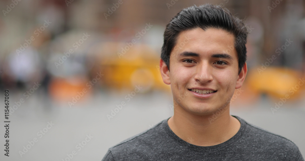 Young latino man in city face portrait smile Young latino man in city face portrait smile