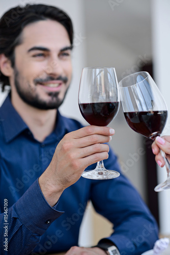 Pretty loving couple drinking wine