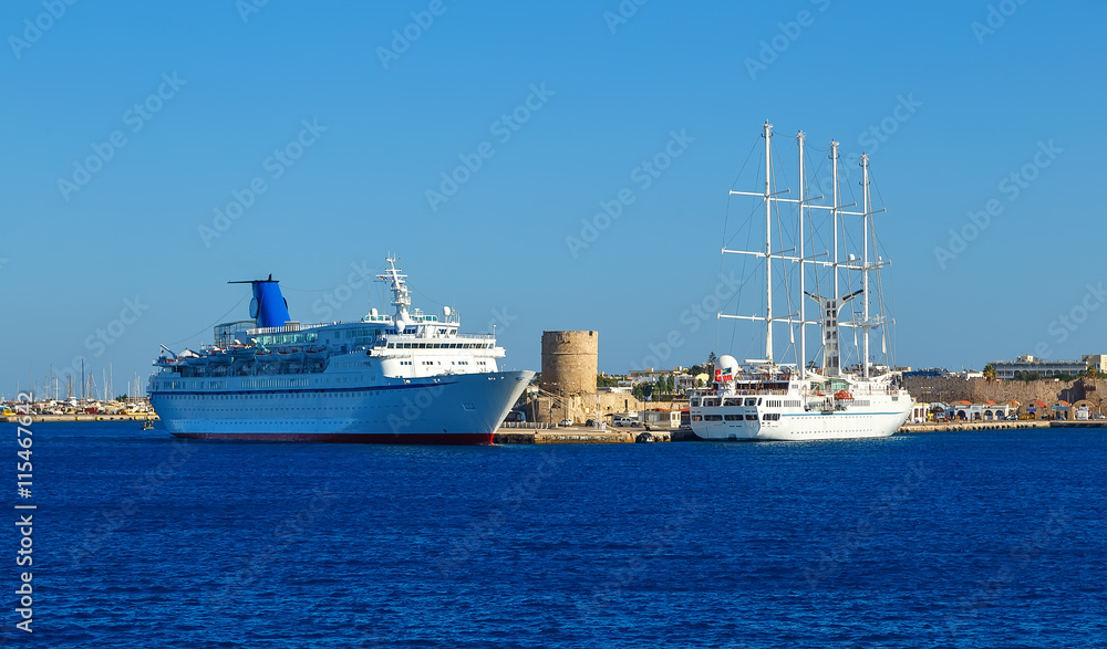 cruise ship, and ships with masts and sails into the port of Rhodes