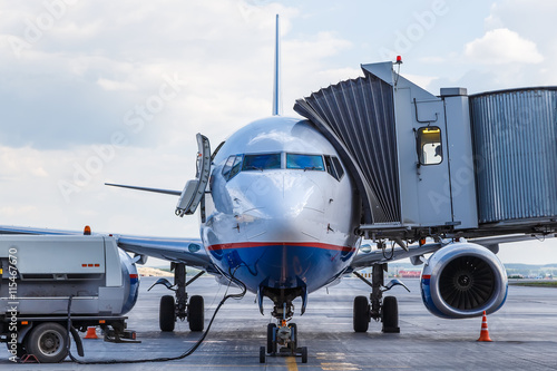 Preparing a passenger jet aircraft for flight at the airport photo