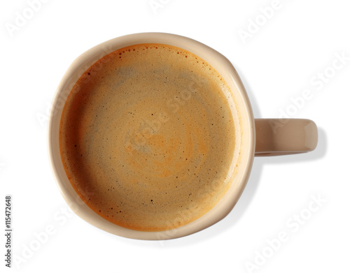 Cup of coffee with foam on light background