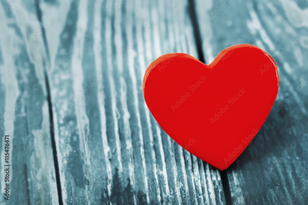 Wooden heart on color wooden background Wooden heart on color wooden background