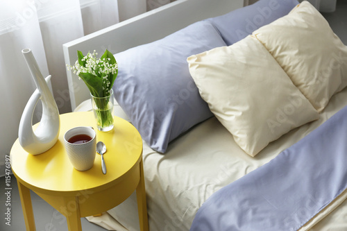 Unmade bed with crumpled bl...