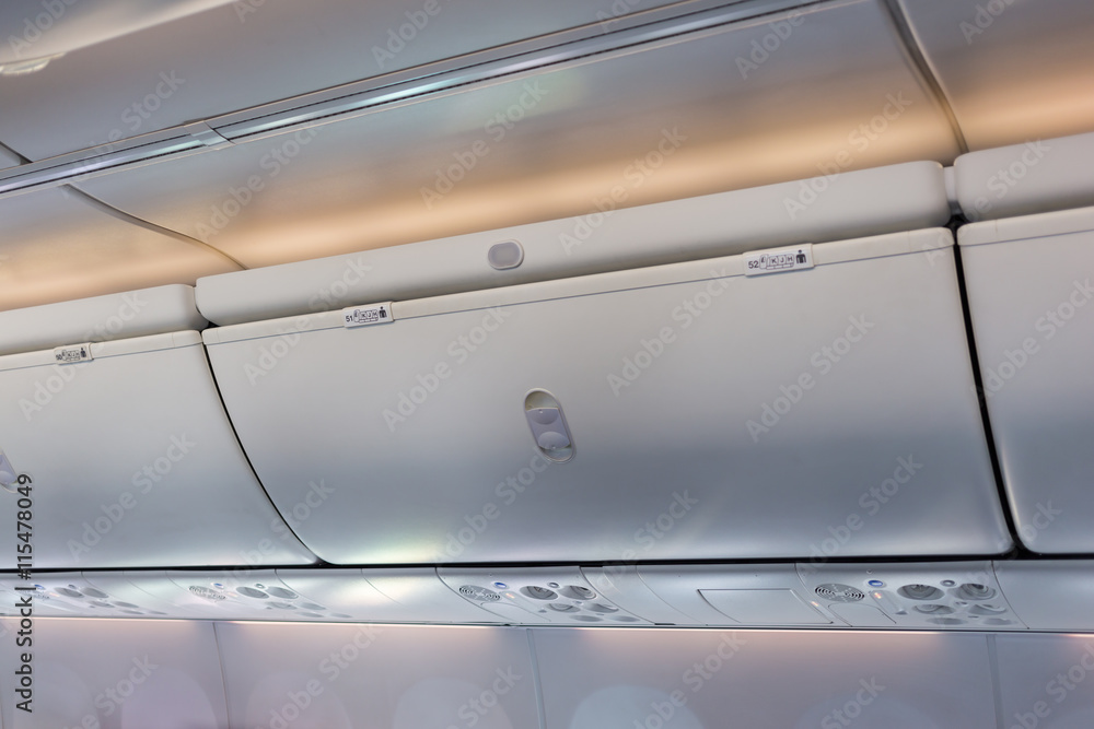 Fototapeta premium Overhead compartment in commercial aircraft.