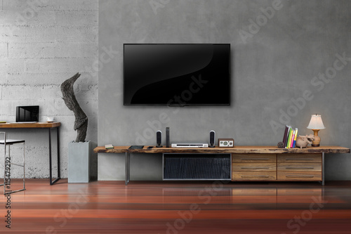 Led tv on concrete wall with wooden table in living room