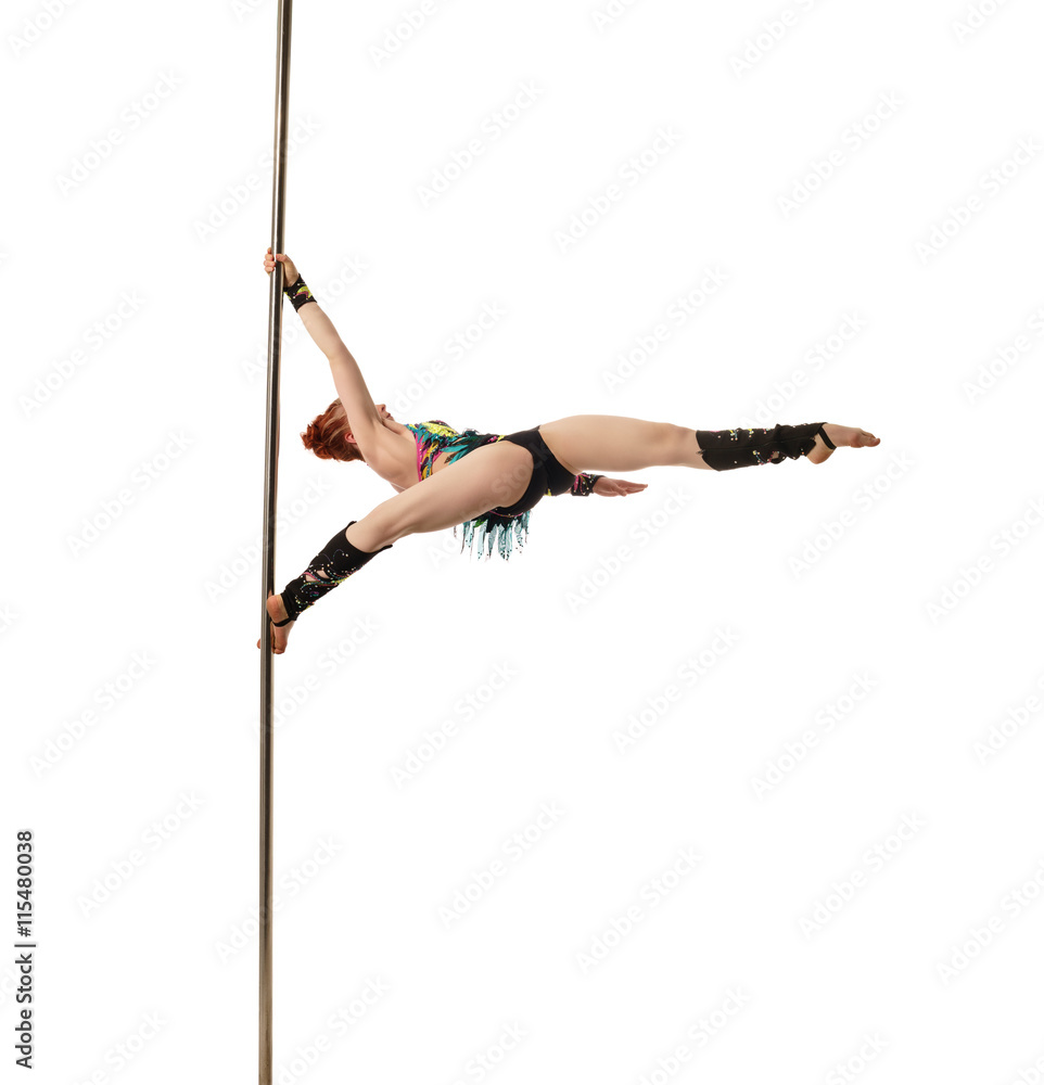 Pretty female gymnast performs trick on pylon Pretty female gymnast performs trick on pylon