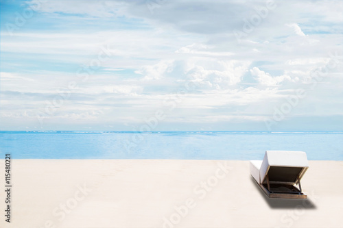 The beach in summer, clear sand and blue sky with beach chairs, idyllic travel background