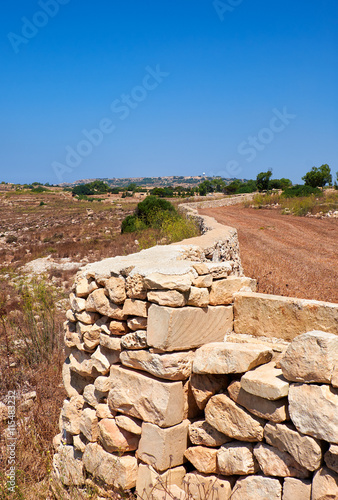The stone fences stretch across the fields of Qrendi, Malta.