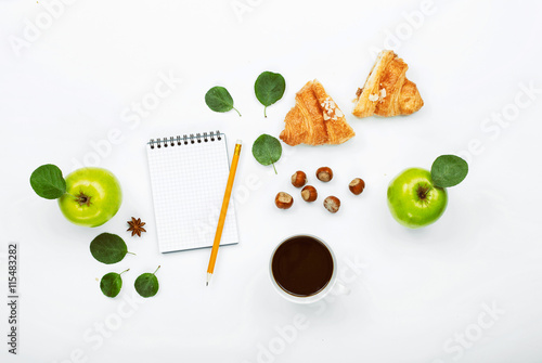 Cup of black coffee, sketchbook with pencil