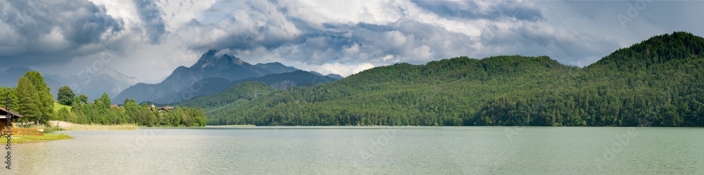 Forggensee Mountain Lake in the south of Bavaria, Germany and the mountains on horizon