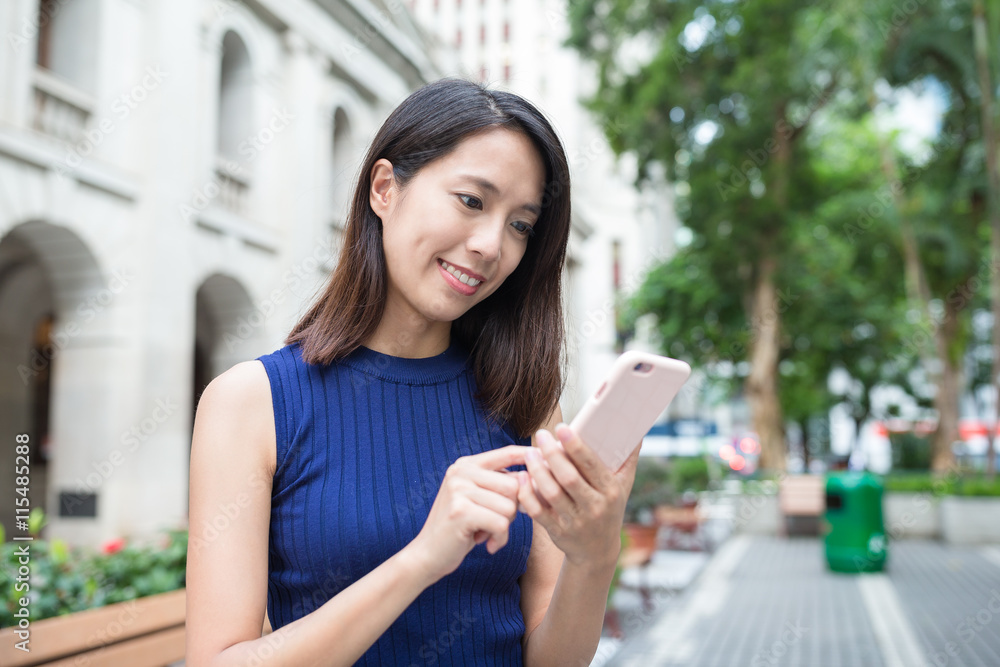 Woman use of mobile phone at outdoor