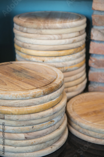 empty wooden round board for pizza