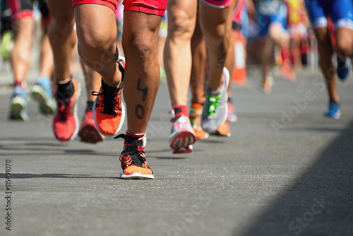 Fototapeta Naklejka Na Ścianę i Meble -  Marathon competition during an ironman the numbers on the leg