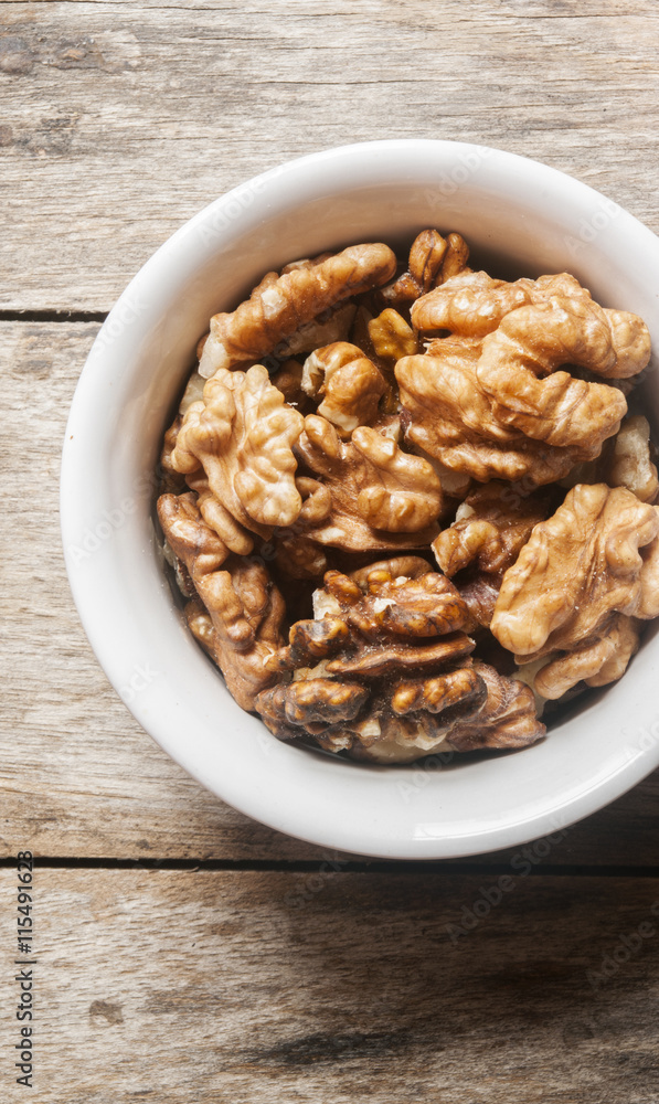 Walnut kernel in a white bowl Walnut kernel in a white bowl