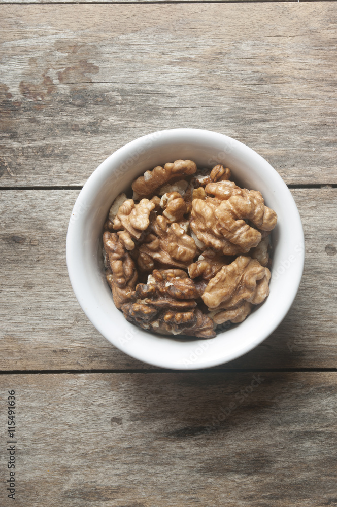Walnut kernel in a white bowl Walnut kernel in a white bowl