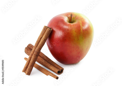 red apple and cinnamon isolated on white background