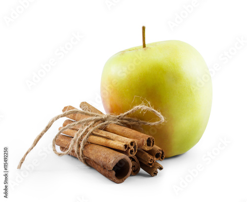 green apple and cinnamon isolated on white background