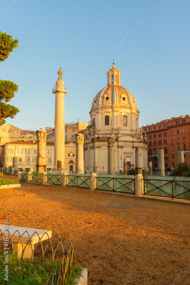 Forum - Roman ruins with column of Trajan in Rome in sunlight, Italy