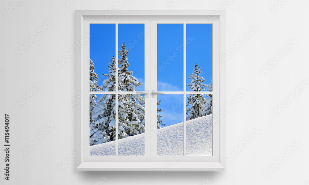 Fototapeta Spójrz przez okno na zimę i śnieg. Na zewnątrz jest zimno.