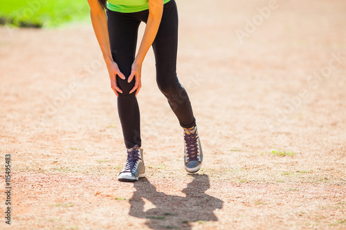 Woman is having pain in leg while jogging.