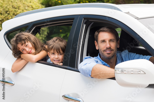 Man in car with children