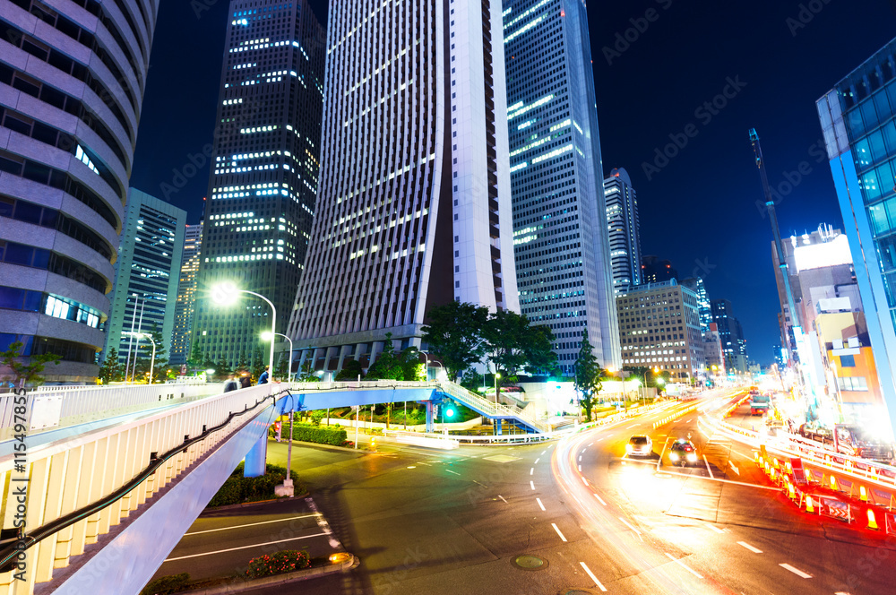 Fototapeta premium busy traffic on road in downtown of tokyo at night