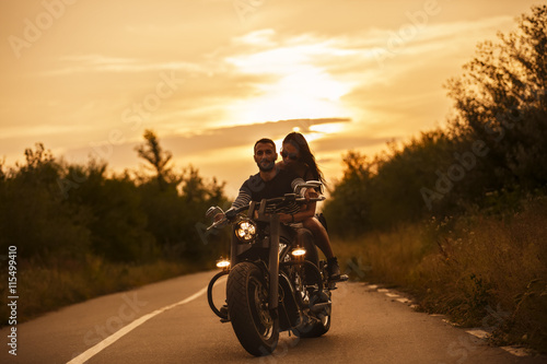 Romantic picture with a couple of beautiful young bikers