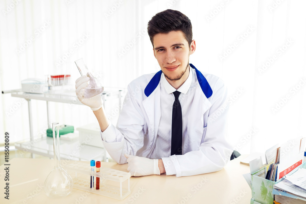 Laboratory scientist working at lab with test tubes
Laboratory scientist working at lab with test tubes