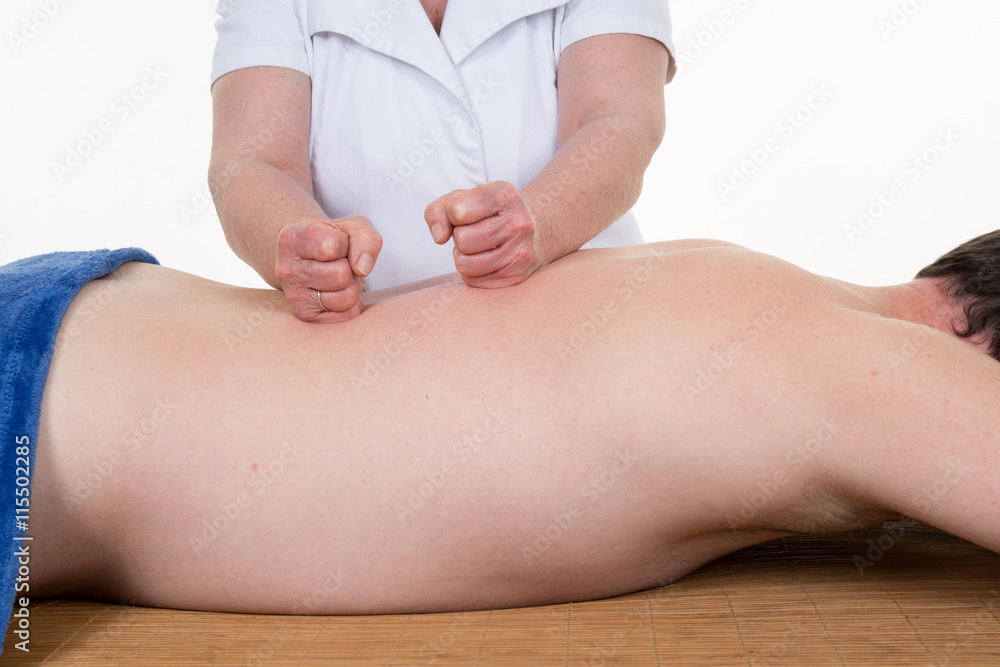Portrait of man receiving massage treatment from female hand Portrait of man receiving massage treatment from female hand