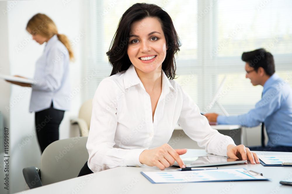 Businesswoman with colleagues Businesswoman with colleagues