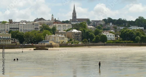 People looking for shellfish at low tide in the Isle of Wight