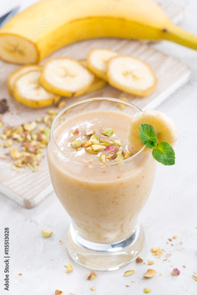 banana milkshake in a glass, top view, vertical banana milkshake in a glass, top view, vertical