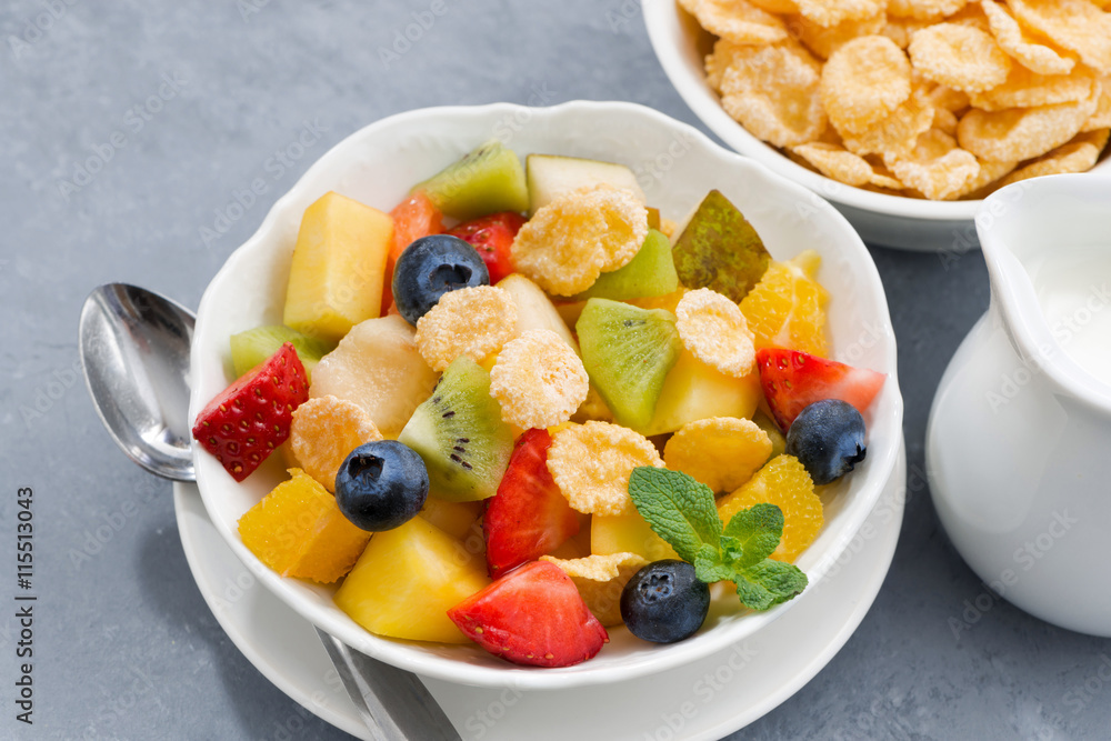 bowl of fresh fruit salad with corn flakes, closeup top view bowl of fresh fruit salad with corn flakes, closeup top view