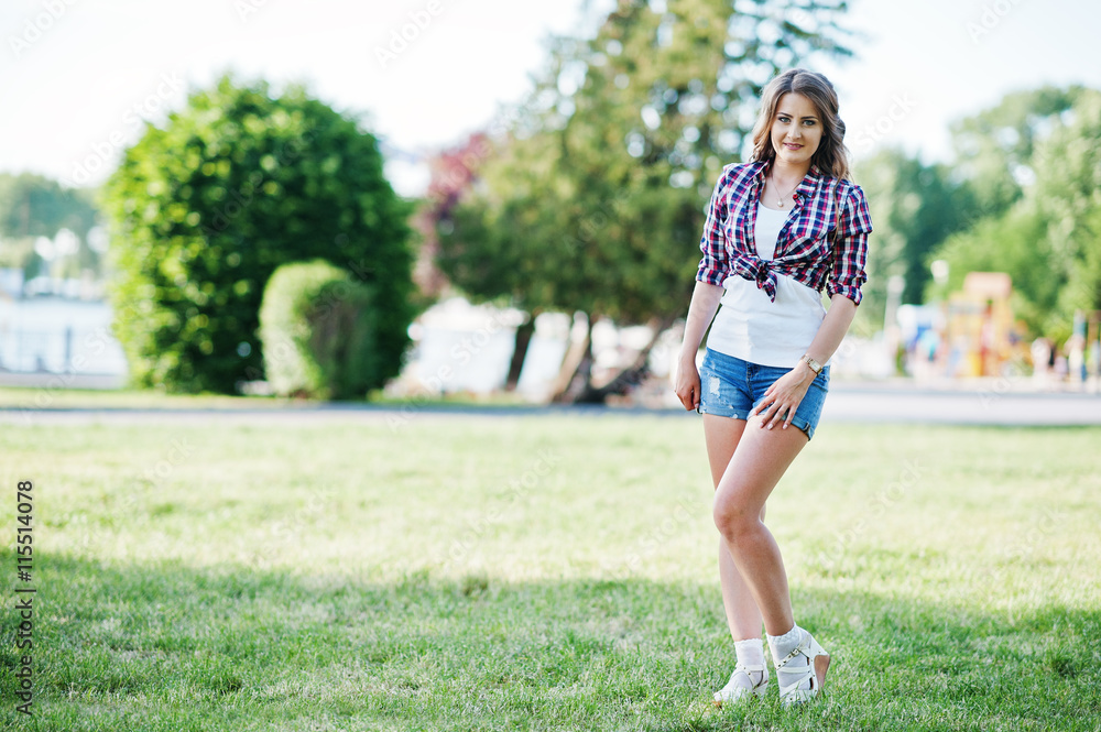 Portrait of style country girl on short jeans shorts and crossco Stock  Photo | Adobe Stock