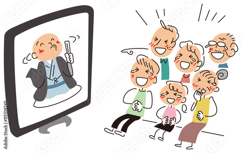 テレビ中継の落語を観て笑う家族