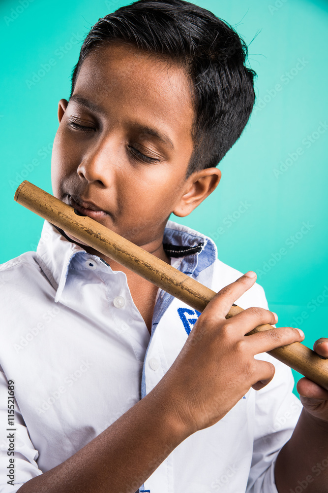 10 year old indian boy playing flute, indian boy and music, indian boy  learning music, indian boy with musical instrument, brown indian boy Stock  Photo | Adobe Stock