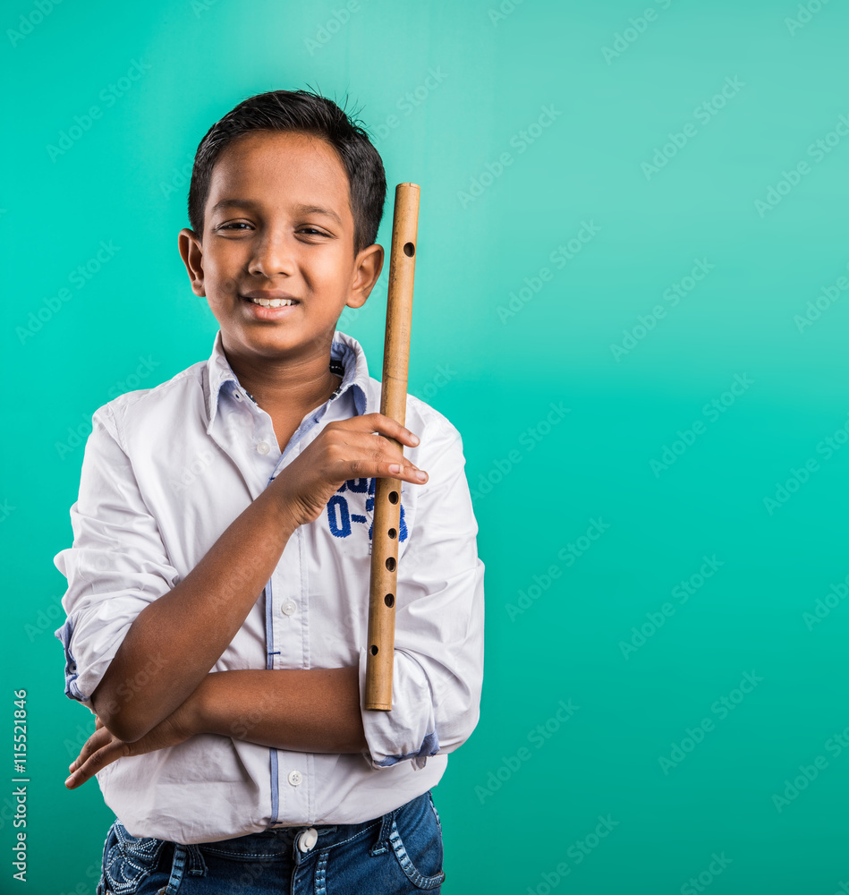 10 year old indian boy playing flute, indian boy and music, indian boy  learning music, indian boy with musical instrument, brown indian boy Stock  Photo | Adobe Stock