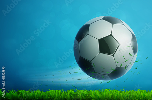 Soccer ball flying in air with grass. Football background.