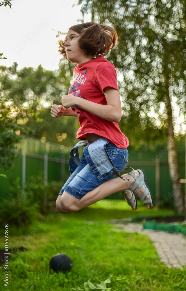 girl jumps in a grass high girl jumps in a grass high