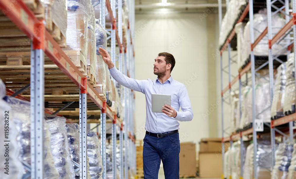 businessman with tablet pc at warehouse businessman with tablet pc at warehouse