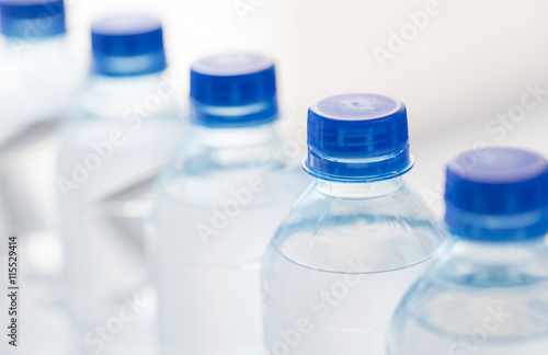 close up of plastic bottles with drinking water