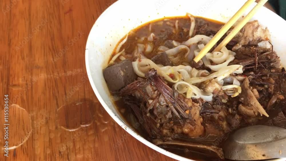 time lapse eating rice noodles with spicy pork sauce. Traditional Northern Thai food is called Kanom Jeen Nam Ngaew.
time lapse eating rice noodles with spicy pork sauce. Traditional Northern Thai food is called Kanom Jeen Nam Ngaew.