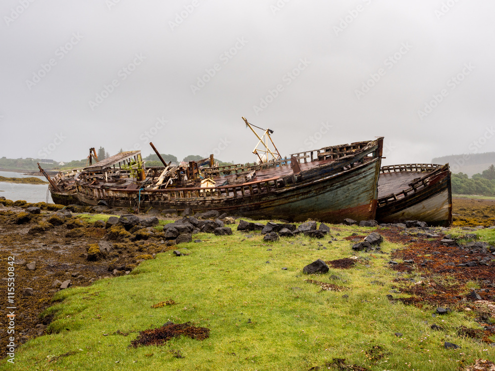 The old wooden boats at Salen Pier, Isle of Mull, Scotland, UK