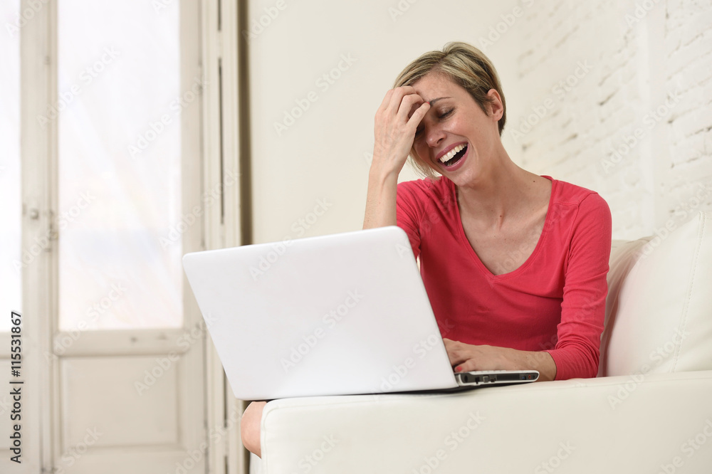 young beautiful woman smiling happy working at home with laptop computer on sofa couch young beautiful woman smiling happy working at home with laptop computer on sofa couch