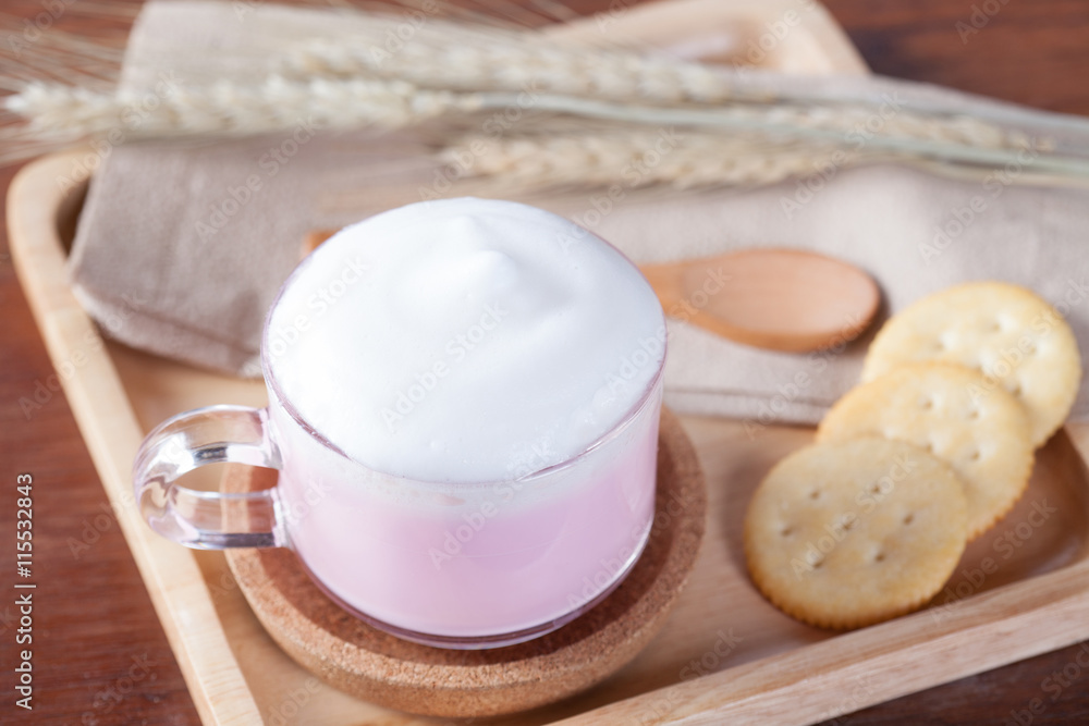 close up hot pink milk with biscuits on wooden plate on wooden t close up hot pink milk with biscuits on wooden plate on wooden t