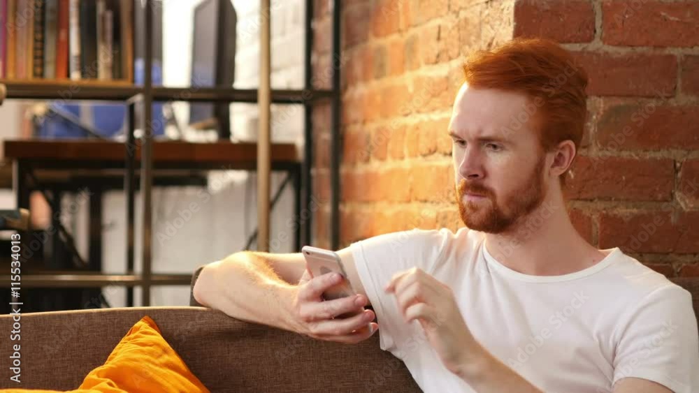Relax Man Using Smartphone, Sitting on Sofa Relax Man Using Smartphone, Sitting on Sofa