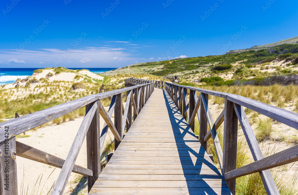 Foot bridge at Cala Mesquida - beautiful coast of island Mallorca, Spain Foot bridge at Cala Mesquida - beautiful coast of island Mallorca, Spain