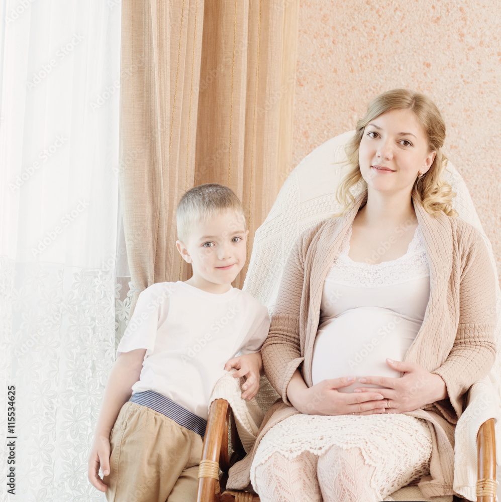 pregnant mother with child in home interior
