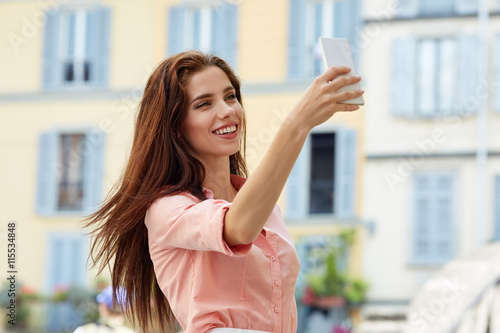 Beautiful woman photographing selfie on a tabl Free Download Beautiful woman photographing selfie on a tabl - GFXLoad