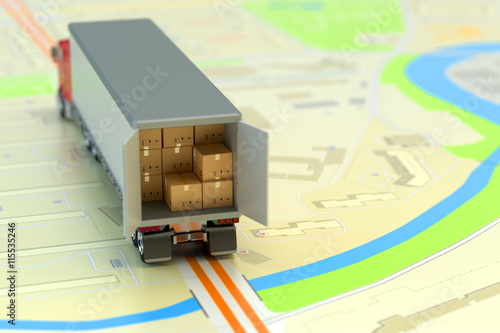 Freight transportation, packages shipment, shipping, logistics and business concept, delivery truck full of cardboard boxes and parcels on paper city map